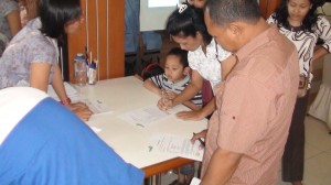 A Village Phone operator signs up to be an agent for KerjaLokal