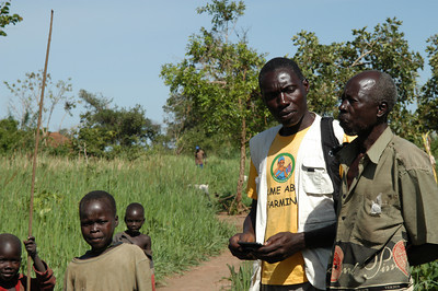 Simon surveying a local farmer