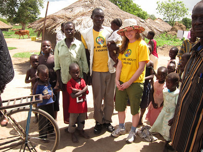 Simon and his family saying goodbye in front of their house